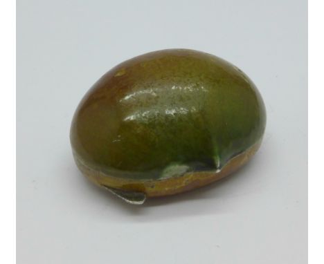 An enamelled Italian silver vesta in the form of a chestnut, enamel chipped