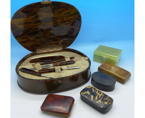 Three snuff boxes, an onyx stamp box, a match bookcase and a tortoiseshell manicure box