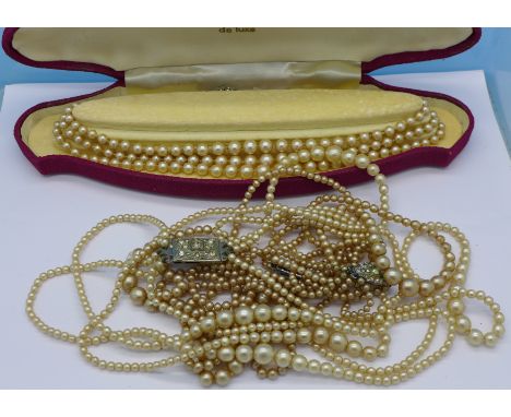 A Lotus silver set three strand faux pearl necklace and three others