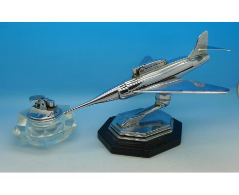 An Art Deco chrome plated aeroplane lighter and a glass table lighter (2)