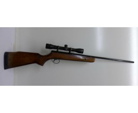 An air rifle with 4x32 scope