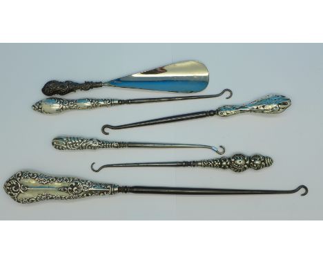 Five silver mounted button hooks and one shoe-horn