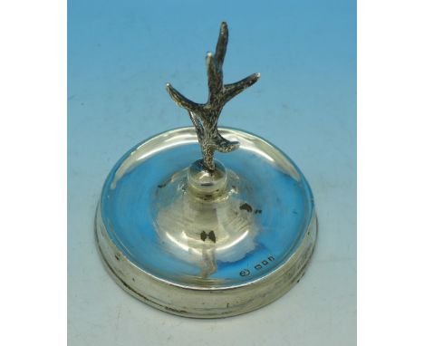 A silver ring stand