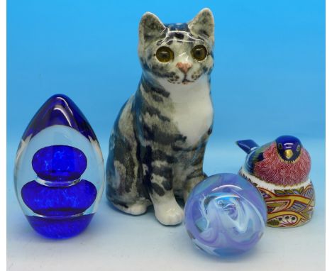 A Winstanley cat, a Royal Crown Derby bullfinch nesting paperweight with gold stopper, a Caithness glass paperweight and one 