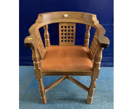 Robert Thompson Mouseman Monk’s chair with tan leather seat and brass studs. With receipt from R. Thompson 2008. 25” w x 23” 