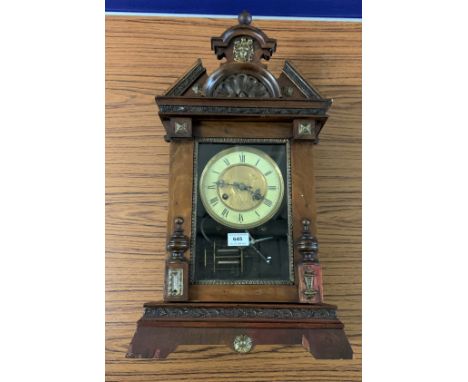 Carved mahogany wall clock with brass/enamel face with antelope design, pendulum &amp; key, 12.5”w x 23”h x 6”d