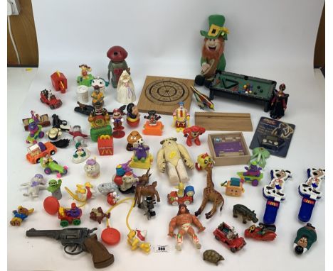 Assorted loose toys inc. Miniature pool table, dartboard, clackers, plastic robot, gun, Leprauchan, McDonalds toys and other 