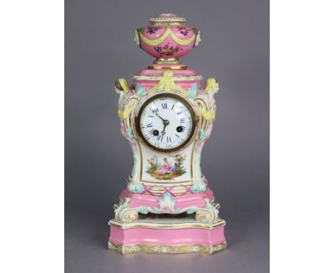 A 19th century Berlin porcelain mantel clock in pink-ground baluster form case, with urn finial &amp; scrolled corners, cheru