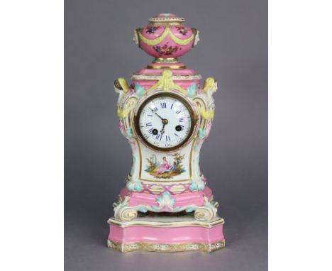 A 19th century Berlin porcelain mantel clock in pink-ground baluster form case, with urn finial &amp; scrolled corners, cheru