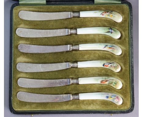 A set of six tea knives with Royal Worcester porcelain pistol-grip handles, each differently painted with a blue-tit, robin, 