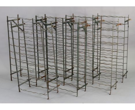 A set of seven vintage wrought metal wine racks, each 20” wide x 40” high x 9” deep.