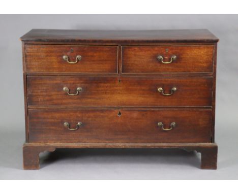 An 18th century mahogany large chest with plain rectangular top, fitted two short &amp; two long graduated drawers with brass