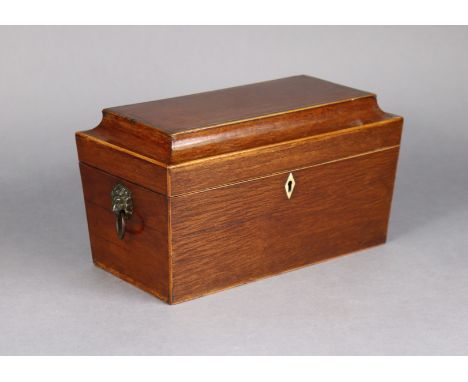 A George III inlaid partridge wood tea caddy of sarcophagus form with brass lion-mask &amp; ring side handles, the hinged lid