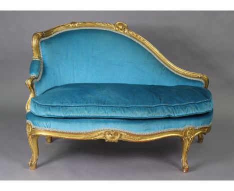 A Victorian giltwood chaise longue of small proportions, with carved shell-scroll &amp; foliate decoration with padded back, 