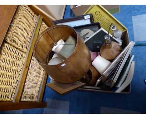 A Box Containing Carved Wooden Table Lamps, Light Shades, Pictures and Prints Etc