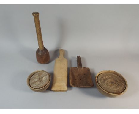 A Collection of 19th Century Wooden Kitchen Tools to Include Two Butter Moulds, Butter Pats, Scoop Etc