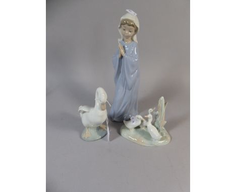 A Collection of Three Nao Ornaments, to Include Girl Praying, Goose and Three Ducks