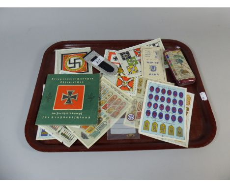A Collection of Printed Nazi WW2 Ephemera Detaining Military Badges Together with Enamel Nazi Badge and Cigar Case with Plan 