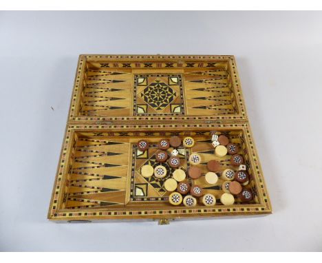 An Inlaid Chess/Backgammon Box with Draught Pieces, 30cm Long 