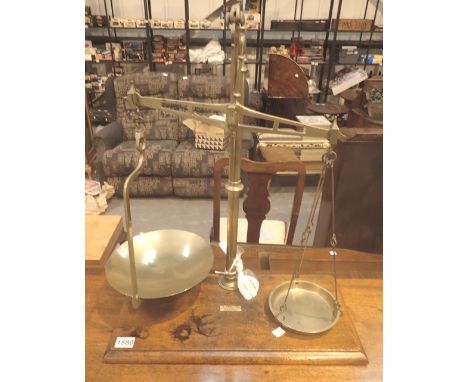 Pair of large brass scales on a mahogany base by W H Hodgson & Sons 