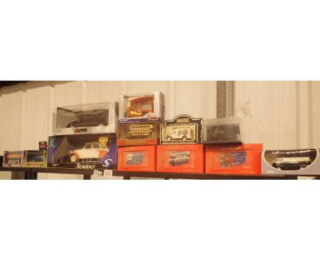 Twelve boxed diecast vehicles, different scales including Corgi 