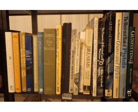 Shelf of books on shooting and guns 