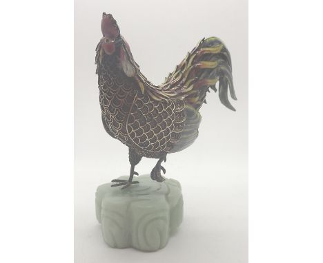 Silver and enamel cockerel mounted on a jade block, H: 9 cm, stamped silver to base 