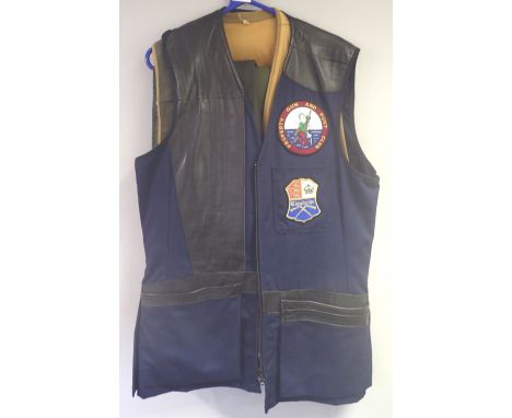 Two shooting waistcoats, size M, two overtrousers and a pair of gaiters