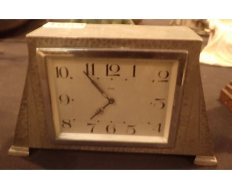 Hand hammered pewter Art Deco mantle clock with eight day movement, L: 20 cm