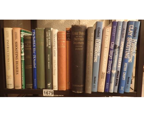 Shelf of shooting books including clay pigeons