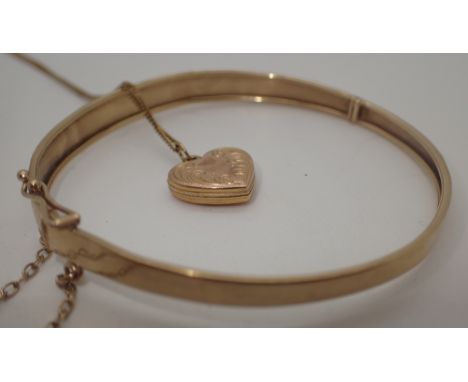 9ct gold bangle and 9ct gold locket and chain, 8.4 g