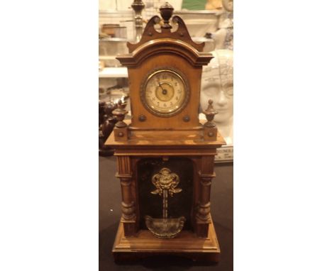 Antique style oak cased mechanical mantle clock, with faux water feature, H: 35 cm