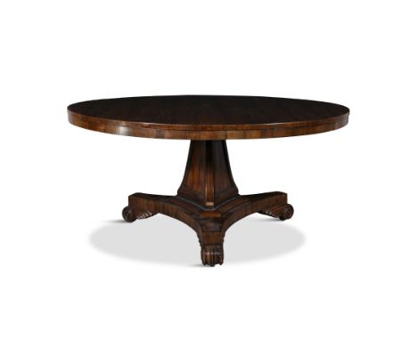 A LARGE WILLIAM IV ROSEWOOD BREAKFAST TABLE.of circular form on triform tapering centre pillar and triangular platform base, 