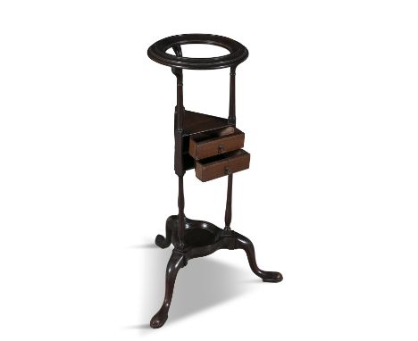 A VICTORIAN MAHOGANY FRAMED JARDINIERE STAND,the circular top and a triform mid section fitted with two small drawers, on spl