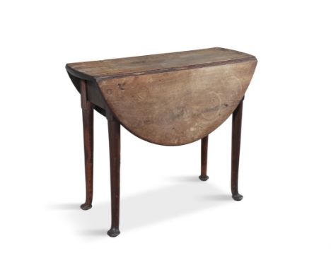 AN IRISH MAHOGANY CIRCULAR DOUBLE DROP LEAF SUPPER TABLE, C.1740on gate-leg supports and club feet. 84cm wide; 69cm highProve