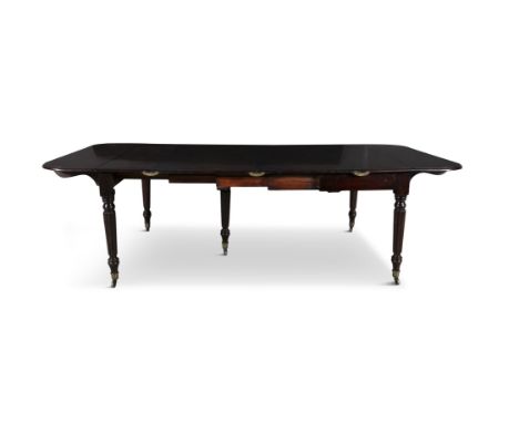 AN UNUSUAL GEORGE IV MAHOGANY EXTENDING DINING TABLE of rectangular form with drop leaf ends with moulded edge on fluted tape