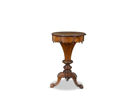 A VICTORIAN INLAID WALNUT WORK TABLE the circular top with inlaid decoration, opening to reveal a fitted interior, on downswe