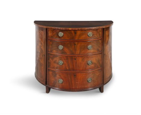 A GEORGE III FLAME MAHOGANY DEMI-LUNE COMMODE, C. 1790the top with satinwood stringing to the rim, above four central long co