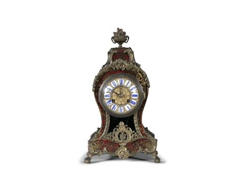 A FRENCH BOULLE WORK MANTLE CLOCK, 19TH CENTURYthe arched case applied with ormolu finial and mounts, housing a gilt metal an