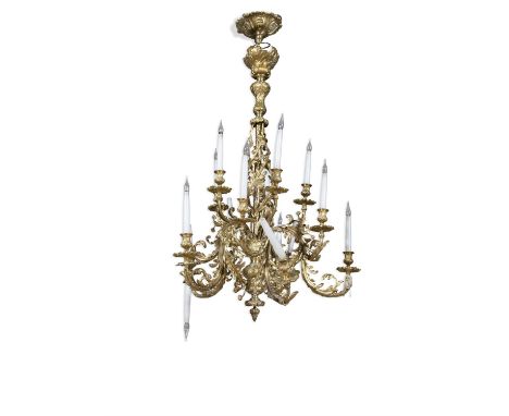 A GILT BRASS FIFTEEN LIGHT CHANDELIERthe central pole with open twist acanthus leaf decoration, and down swept acanthus leaf 