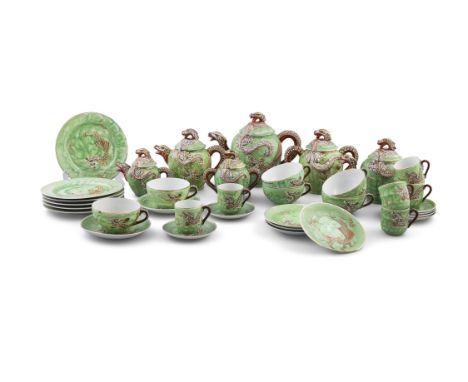 A TWENTY FOUR PIECE JAPANESE GEISHA LITHOPHANE PORCELAIN DRAGON TEA AND COFFEE SERVICEin green tones decorated with dragons i