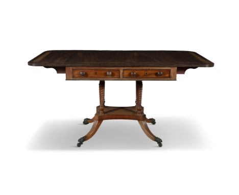 A REGENCY MAHOGANY AND ROSEWOOD BANDED SOFA TABLE on four column twist support, with platform stretcher, downswept legs with 