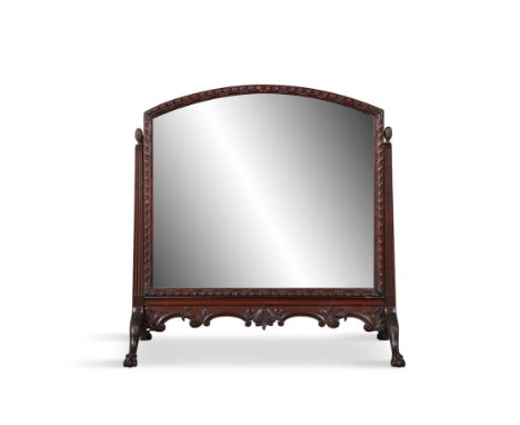 AN EDWARDIAN MAHOGANY CRUTCH FRAMED DRESSING TABLE MIRROR,fitted with arched adjustable plate, on splayed paw carved feet. 74