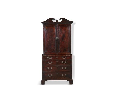 A FINE GEORGE III MAHOGANY SECRETAIRE BOOKCASE, of compact form the broken swan neck cornice with rosette terminals, above fi