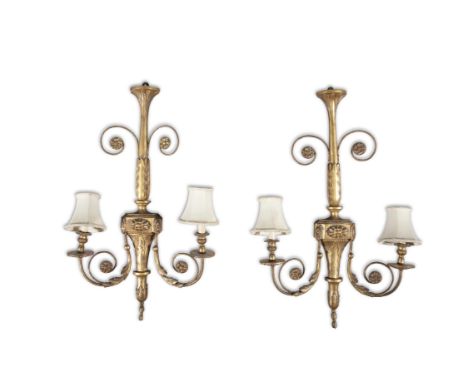  A PAIR OF GILDED GESSO TWO-LIGHT WALL SCONCESwith central column applied with acanthus leaves, with twin scroll arms candle 