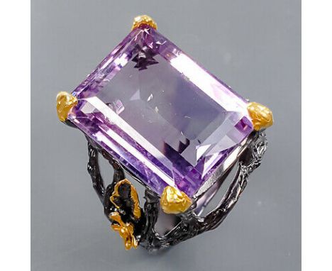 A 925 silver ring set with a large emerald cut amethyst, (R).