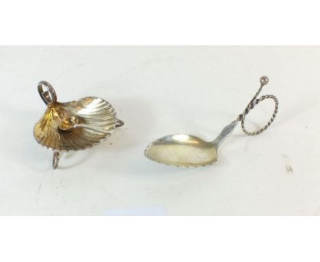 A silver shell form salt an spoon with gilt interior plus a white metal caddy spoon marked '88'
