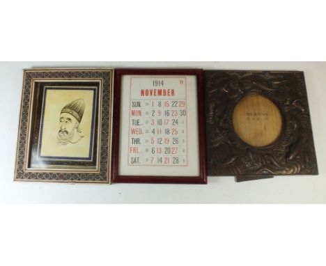 Three various old frames: one with a 1914 calendar, a Japanese metal frame with Koi carp decoration and a Persian frame with 