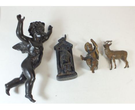 Four metal figures including two cherubs, dog door knocker and a cold painted spelter stag
