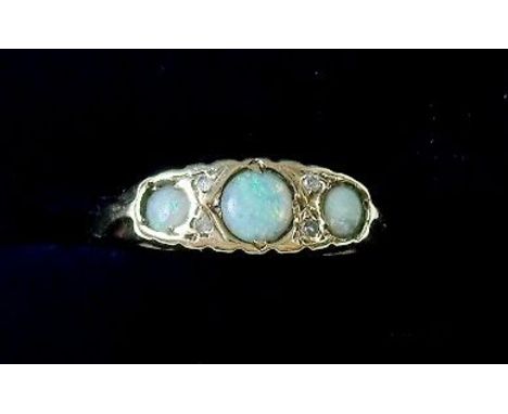 A 9 carat gold opal and diamond ring, size M